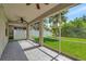 Spacious screened porch overlooking backyard with lush green grass at 10906 Holly Cone Dr, Riverview, FL 33569