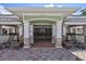 Covered pool bar with seating and TVs at 10906 Holly Cone Dr, Riverview, FL 33569