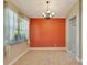 Bright dining room with an accent wall and tile floors at 10906 Holly Cone Dr, Riverview, FL 33569