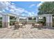 Outdoor fire pit with seating area and pergola at 10906 Holly Cone Dr, Riverview, FL 33569
