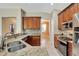 Modern kitchen with stainless steel appliances and granite counters at 10906 Holly Cone Dr, Riverview, FL 33569