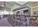 Relaxing pool bar with seating and TVs at 10906 Holly Cone Dr, Riverview, FL 33569