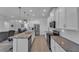 Open concept kitchen with stainless steel appliances and granite countertops at 13333 Gershwin Ln, Port Charlotte, FL 33981