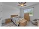 Cozy bedroom with a double bed, dresser, and ceiling fan at 13333 Gershwin Ln, Port Charlotte, FL 33981