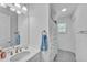 Clean bathroom with white vanity and shower/tub combo at 13333 Gershwin Ln, Port Charlotte, FL 33981