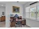 Home office with built-in desk and ample natural light at 13333 Gershwin Ln, Port Charlotte, FL 33981