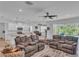 Spacious living room with large windows and comfortable seating at 13333 Gershwin Ln, Port Charlotte, FL 33981