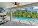 Relaxing screened-in pool and patio area with lush landscaping at 13333 Gershwin Ln, Port Charlotte, FL 33981