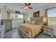 Spacious Primary bedroom with king-size bed and large windows at 13333 Gershwin Ln, Port Charlotte, FL 33981