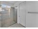 Clean bathroom with a walk-in shower and tile flooring at 13333 Gershwin Ln, Port Charlotte, FL 33981