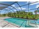 Inviting screened pool with plenty of room for lounging at 13333 Gershwin Ln, Port Charlotte, FL 33981