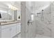 Bathroom with walk-in shower and double vanity at 6248 Bradford Woods Dr, Zephyrhills, FL 33542