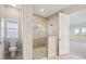 Bathroom with walk-in shower, toilet and separate vanity at 10324 Longmeadow Ave, Parrish, FL 34219