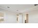Spacious bedroom with neutral decor and access to other rooms at 10324 Longmeadow Ave, Parrish, FL 34219