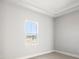 Bright bedroom with large window and neutral walls at 10324 Longmeadow Ave, Parrish, FL 34219