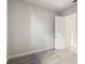 Simple bedroom with door to hallway at 10324 Longmeadow Ave, Parrish, FL 34219