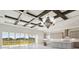 Spacious kitchen with an island, stainless steel appliances, and coffered ceiling at 10324 Longmeadow Ave, Parrish, FL 34219