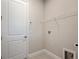 Bright laundry room with shelving and hookups at 10324 Longmeadow Ave, Parrish, FL 34219