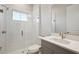Modern bathroom with gray vanity and glass shower at 10426 Longmeadow Ave, Parrish, FL 34219