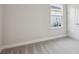 Bright bedroom with window and neutral wall colors at 10426 Longmeadow Ave, Parrish, FL 34219