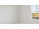 Bright bedroom with large window and neutral wall colors at 10426 Longmeadow Ave, Parrish, FL 34219