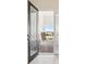 Open front door revealing a spacious entryway and paved patio at 10426 Longmeadow Ave, Parrish, FL 34219