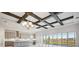 Modern kitchen with gray cabinets, quartz countertops, and stainless steel appliances at 10426 Longmeadow Ave, Parrish, FL 34219