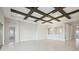 Spacious living area with high ceilings, exposed beams and hardwood floors at 10426 Longmeadow Ave, Parrish, FL 34219