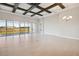 Spacious living area with large windows and high ceilings at 10426 Longmeadow Ave, Parrish, FL 34219