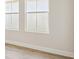 Bright bedroom with two large windows and hardwood floors at 10422 Longmeadow Ave, Parrish, FL 34219