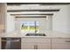 Kitchen island with quartz countertop and stainless steel appliances at 10422 Longmeadow Ave, Parrish, FL 34219