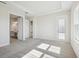 Spacious bedroom with door to bathroom and access to exterior at 10422 Longmeadow Ave, Parrish, FL 34219