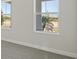 Bedroom with large windows offering a view of the outdoors at 10422 Longmeadow Ave, Parrish, FL 34219