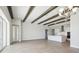 Open concept kitchen with white cabinets, an island, and stainless steel appliances at 10422 Longmeadow Ave, Parrish, FL 34219