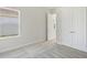 Bright bedroom with window and double doors leading to closet at 10422 Longmeadow Ave, Parrish, FL 34219