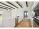 Modern kitchen island with white cabinets and quartz countertops at 10422 Longmeadow Ave, Parrish, FL 34219