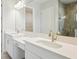 Double vanity bathroom with modern finishes and large shower at 10422 Longmeadow Ave, Parrish, FL 34219