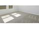 Bright bedroom with carpeted floors and large windows at 10422 Longmeadow Ave, Parrish, FL 34219