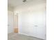 Spacious bedroom with double doors leading to the closet and another room at 10422 Longmeadow Ave, Parrish, FL 34219