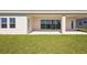 Covered patio with sliding glass doors leading to backyard at 10422 Longmeadow Ave, Parrish, FL 34219