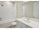 Clean bathroom with a shower/tub combo and modern vanity at 10422 Longmeadow Ave, Parrish, FL 34219