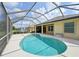 Inviting kidney-shaped pool with screened enclosure at 1349 Misty Greens Dr, Sun City Center, FL 33573