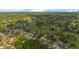Aerial view of a home in a lush, green neighborhood with a golf course and mature trees at 2618 Crestfield Dr, Valrico, FL 33596