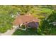 Beautiful aerial view of a house with a brown roof overlooking a golf course on a sunny day at 2618 Crestfield Dr, Valrico, FL 33596