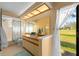 Bright bathroom with vanity, window, and shower-tub combination, offering both functionality and natural light at 2618 Crestfield Dr, Valrico, FL 33596