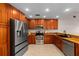 Modern kitchen with stainless steel appliances, granite countertops, and ample cabinet space at 2618 Crestfield Dr, Valrico, FL 33596