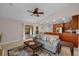 Spacious living room with a ceiling fan and sliding glass doors, providing access to outdoor living spaces at 2618 Crestfield Dr, Valrico, FL 33596