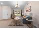 Inviting living room with lots of natural light, neutral walls, modern decor, and stylish light fixture at 2618 Crestfield Dr, Valrico, FL 33596