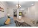 Open-concept living room seamlessly connects to the dining area, bathed in natural light with stylish decor at 2618 Crestfield Dr, Valrico, FL 33596