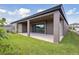 Covered patio with sliding glass doors leading to the backyard at 13150 Homestead Ln, Parrish, FL 34219